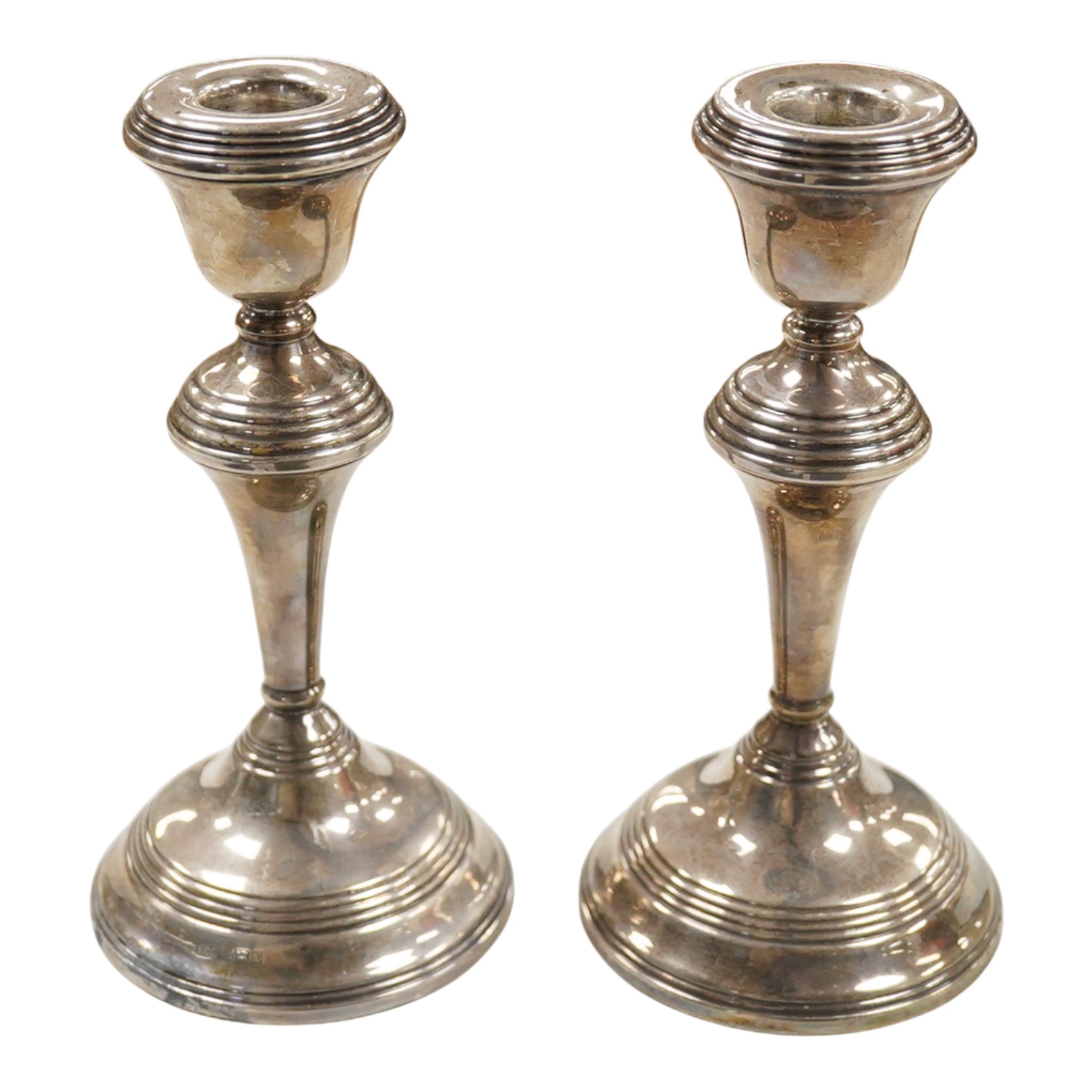 A pair of Elizabeth II silver mounted candlesticks, W.I. Broadway & Co, Birmingham, 1972, weighted, 17.7cm.
